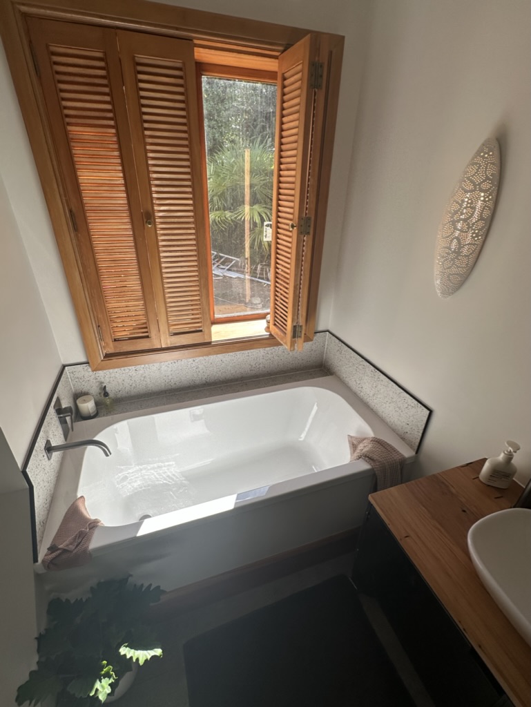 New bath tub with original timber window features